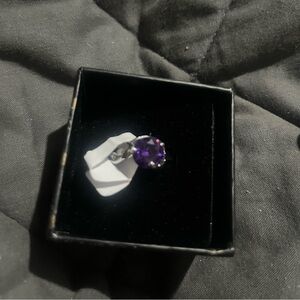 Women’s size 9 ring with amethyst colored gemstone